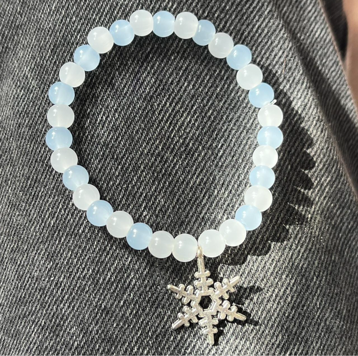 Pastel blue and white bracelet with silver snowflake