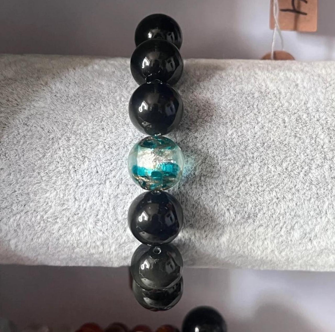 Black bracelet with glass bead