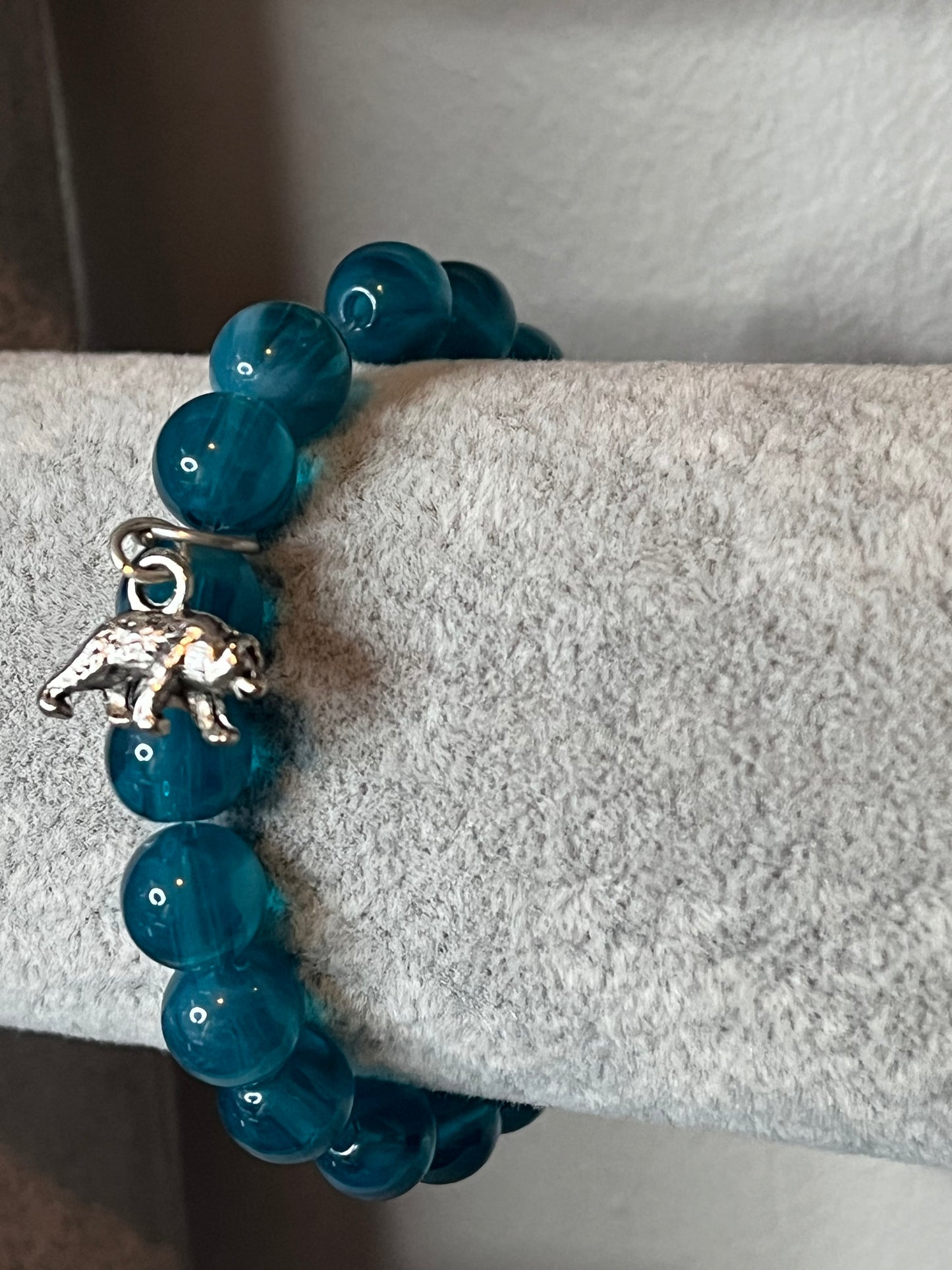 Turquoise glass bracelet with silver bear