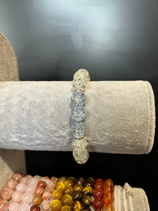 White and blue cracked glass bracelet with silver separators ￼