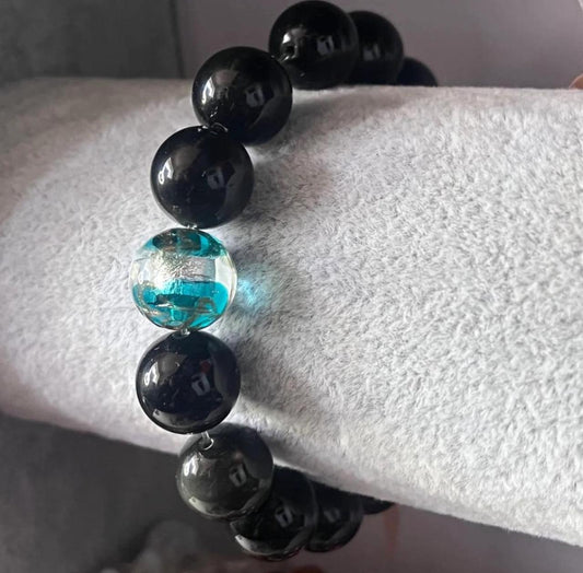 Black bracelet with glass bead