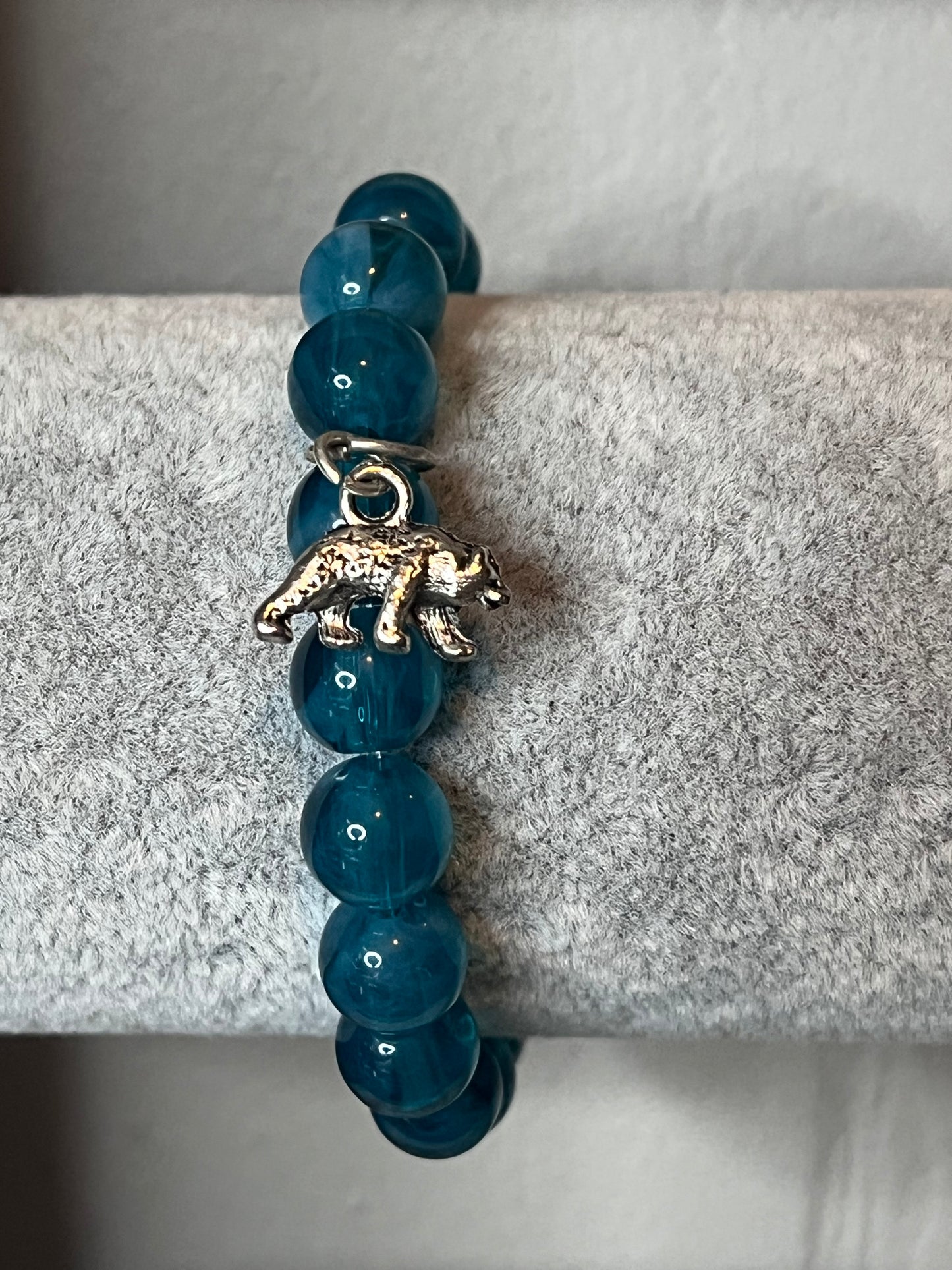 Turquoise glass bracelet with silver bear